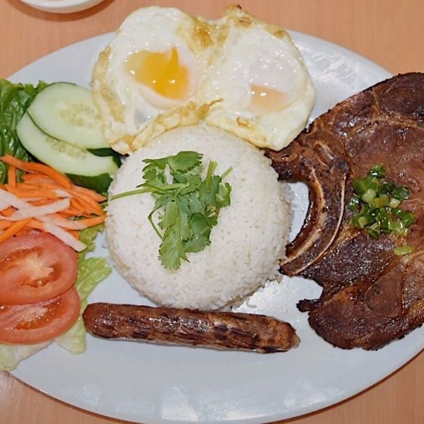 C9. Charbroiled Pork Chop, Chinese Sausage, Sunny Side Egg on Steamed Broken Rice